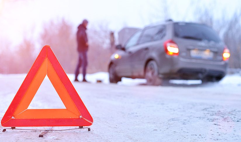 Car breakdown or accident on winter road.