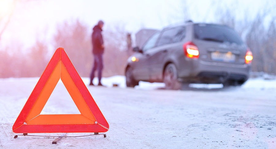 Car breakdown or accident on winter road.