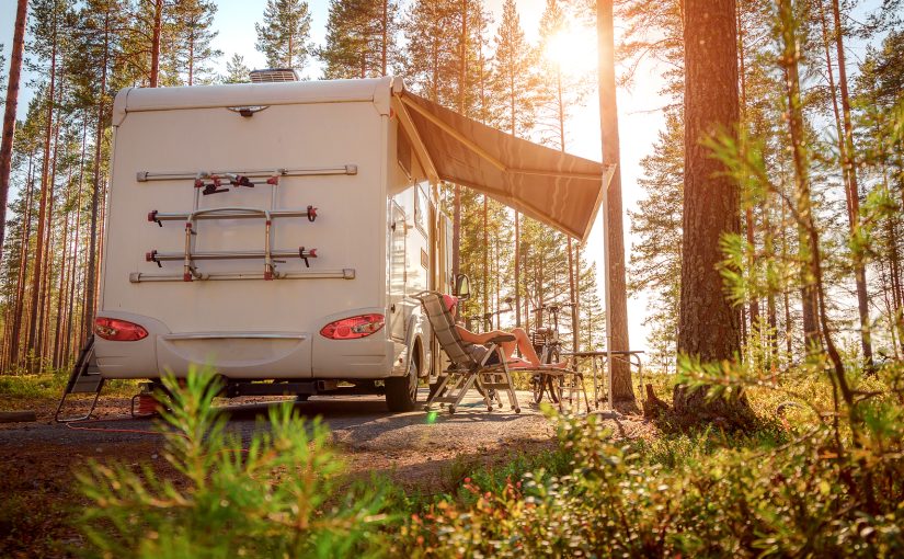 RV set up in wood for camping.