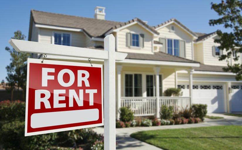 House with red For Rent sign hanging outside.