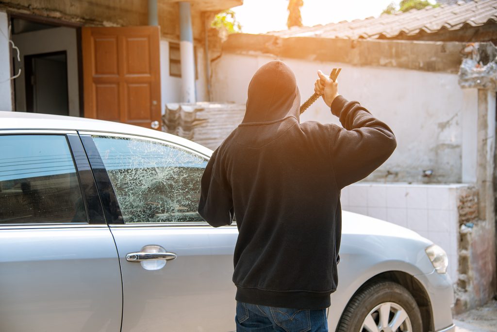 Car Thief Breaking Window Glass