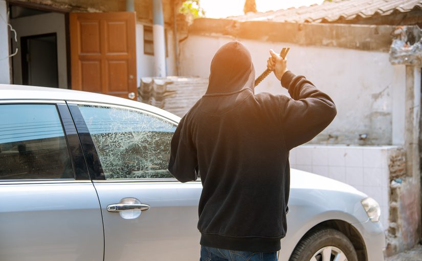 Car Thief Breaking Window Glass