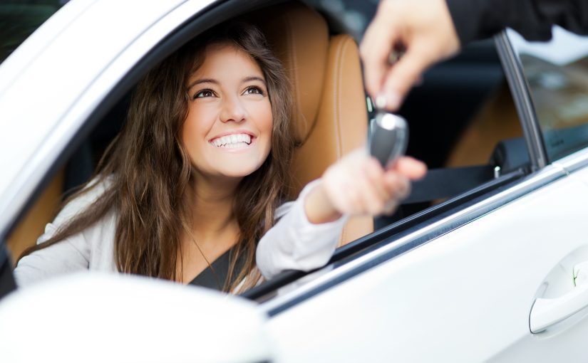 College student receiving keys to a car.